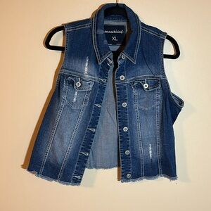 Distressed cropped denim vest.